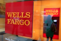 FILE PHOTO: A Wells Fargo sign is seen outside a banking branch in New York July 13, 2012. REUTERS/Shannon Stapleton/File Photo