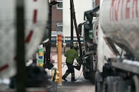 Fuel tankers are filled at the Valero Manchester Terminal, in Manchester, England, Tuesday, Sept. 28, 2021.