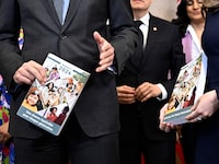 Prime Minister Justin Trudeau, Deputy Prime Minister, left, and Minister of Finance Chrystia Freeland hold copies of the federal budget as they pose for a photo before its tabling, on Parliament Hill in Ottawa, on Tuesday, April 16, 2024. THE CANADIAN PRESS/Justin Tang