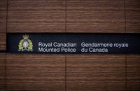 The RCMP logo is seen outside Royal Canadian Mounted Police "E" Division Headquarters, in Surrey, B.C., on Friday April 13, 2018. Two Montreal-area Chinese groups and their director have filed a defamation suit against the RCMP for alleging they hosted clandestine Chinese government "police stations." THE CANADIAN PRESS/Darryl Dyck