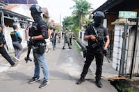 Anti-terror police "Densus 88" conduct a raid in Tangerang on May 16, 2018, following a recent spate of terror attacks in Indonesia. 
The attacks have put Indonesia on edge -- and sparked a string of travel advisories from foreign governments -- as the world's biggest Muslim-majority country starts the holy fasting month of Ramadan from Thursday.  / AFP PHOTO / DEMY SANJAYADEMY SANJAYA/AFP/Getty Images