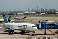 FILE PHOTO: The New York skyline are seen while United Airlines planes use the tarmac at Newark Liberty International Airport in Newark, New Jersey, U.S., May 12, 2023. REUTERS/Eduardo Munoz/File Photo