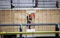 An employee works on a modular home component at NRB Modular Solutions in Calgary, Friday, April 5, 2024.THE CANADIAN PRESS/Jeff McIntosh