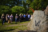 People take part in a vigil at the Women's Monument in Petawawa, Ont., following the jury's release of recommendations in the Borutski inquest in Pembroke, Ont., on Tuesday, June 28, 2022. Borutski, who was convicted in 2017 in the murders of three women in Renfrew County, died in prison last week of what officials say were natural causes. THE CANADIAN PRESS/Sean Kilpatrick