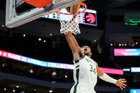 Milwaukee Bucks' Giannis Antetokounmpo dunks during the second half of the team's NBA basketball game against the Toronto Raptors on Sunday, March 19, 2023, in Milwaukee. (AP Photo/Aaron Gash)