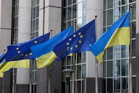 FILE PHOTO: Flags of Ukraine fly in front of the EU Parliament building on the first anniversary of the Russian invasion, in Brussels, Belgium February 24, 2023. REUTERS/Yves Herman/File Photo