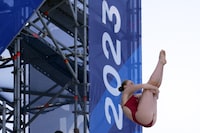 Molly Carlson of Canada dives during the round 3 of Women's 20-metre high diving at the World Swimming Championships at Seaside Momochi Beach Park in Fukuoka, Japan, Wednesday, July 26, 2023. The Red Bull Cliff Diving World Series is coming to Montreal this summer. THE CANADIAN PRESS/AP/Eugene Hoshiko