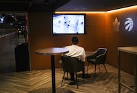 A Scotiabank Arena employee watches the Toronto Maple Leafs take on the Tampa Bay Lightning during NHL first round Stanley Cup playoff hockey action in Toronto, on Thursday, April 27, 2023. THE CANADIAN PRESS/Chris Young