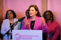 FILE - Michigan Gov. Gretchen Whitmer addresses supporters before signing legislation to repeal the 1931 abortion ban statute, which criminalized abortion in nearly all cases, during a bill signing ceremony, April 5, 2023, in Birmingham, Mich. Two key pieces of legislation that would have repealed a 24-hour wait period required for patients receiving an abortion and also allowed state Medicaid dollars to pay for abortions were left out of a package signed Tuesday, Nov. 21, 2023, by Whitmer. (AP Photo/Carlos Osorio, File)