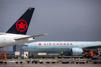 FILE PHOTO: FILE PHOTO: Air Canada planes are parked at Toronto Pearson Airport in Mississauga, Ontario, Canada April 28, 2021. REUTERS/Carlos Osorio/File Photo/File Photo