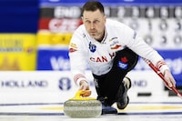 Canada's skip Brad Gushue delivers a stone against the Czech Republic at the men's Curling World Championships in Schaffhausen, Switzerland, Saturday, March 30, 2024. (Michael Buholzer/Keystone via AP)