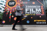 A person walks past the Toronto International Film Festival (TIFF) Bell Lightbox in the Entertainment District of  Toronto, on Thursday, Aug. 17, 2023. THE CANADIAN PRESS/Spencer Colby