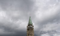 Storm clouds pass by the Peace tower and Parliament hill Tuesday August 18, 2020 in Ottawa. THE CANADIAN PRESS/Adrian Wyld