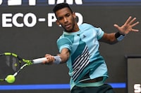 Canada's Felix Auger-Aliassime hits a return against Denmark's Holger Rune in their men's singles match during the China Open tennis tournament at the National Tennis Center in Beijing on September 29, 2023. (Photo by Pedro PARDO / AFP) (Photo by PEDRO PARDO/AFP via Getty Images)