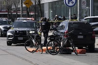 Police work the scene of a fatal shooting in downtown Toronto, Tuesday, March 12, 2024. THE CANADIAN PRESS/Arlyn McAdorey