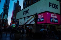 A Fox logo in Times Square in Manhattan, on April 10, 2023. On Monday, April 17, a judge in Delaware Superior Court is expected to swear in the jury in a defamation trial that has little precedent in American law. (John Taggart/The New York Times)