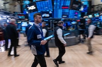 Traders work on the floor during morning trading at the New York Stock Exchange (NYSE) on March 6.