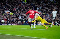 Manchester United's Jadon Sancho shoots on goal during the English FA Cup quarterfinal soccer match between Manchester United and Fulham at the Old Trafford stadium in Manchester, England, Sunday, March 19, 2023. (AP Photo/Jon Super)