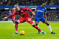 Preston's Liam Millar, left, and Chelsea's Raheem Sterling vie for the ball during the English FA Cup soccer match between Chelsea and Preston North End at Stamford Bridge stadium in London, Saturday, Jan. 6, 2024. On loan from Switzerland's FC Basel to Preston North End near where he grew up, Canadian forward Millar has enjoyed being closer to family and friends in England.n THE CANADIAN PRESS/AP/Kirsty Wigglesworth