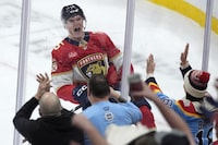 Florida Panthers center Anton Lundell celebrates after he scored the winning goal during an overtime period of an NHL hockey game against the Ottawa Senators, Tuesday, Feb. 20, 2024, in Sunrise, Fla. The Panthers beat the Senators 3-2 in overtime. (AP Photo/Wilfredo Lee)