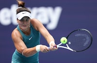 MIAMI GARDENS, FLORIDA - MARCH 26: Bianca Andreescu of Canada plays a backhand against Sofia Kenin of the United States in their third round match at Hard Rock Stadium on March 26, 2023 in Miami Gardens, Florida. (Photo by Clive Brunskill/Getty Images)