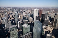 Office towers and other areas of Toronto are photographed from the CN Tower’s main observation level on Jan 29, 2024.