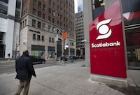 A large sign for Scotiabank stands on the sidewalk at Queen St. West and Bay St. on April 12, 2022. Fred Lum/The Globe and Mail. 