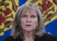 Nova Scotia auditor general Kim Adair answers questions at a news conference in Halifax on Tuesday, Nov. 23, 2021. Adair says in a new report that says there is weak oversight of children in temporary care or youth homes, which increases the risk that vulnerable children will not be properly cared for. THE CANADIAN PRESS/Andrew Vaughan