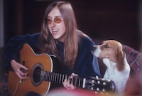 Photo 7- Judee with guitar and dog-February 1971 (Credit_ Greenwich Entertainment).jpeg.   
LOST ANGEL_The Genius Of Judee Sill (Credit: Greenwich Entertainment)