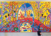 A worker installs Canadian Aboriginal artist Norval Morrisseau's painting "Androgyny" in the ballroom at Rideau Hall Thursday, Sept. 18, 2008 in Ottawa. Measuring 3.66m high and 6.1m wide, "Androgyny" replaces "Charlottetown Revisited", a work created by the Jean Paul Lemieux, which has been on display since 2006. THE CANADIAN PRESS/Adrian Wyld