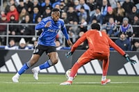 CF Montreal's Mason Toye, left, gets by Orlando City goalkeeper Pedro Gallese to score during first half MLS soccer action in Montreal, Saturday, April 20, 2024. THE CANADIAN PRESS/Graham Hughes