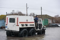 Kazakh rescuers evacuate residents of the flooded settlement of Pokrovka, some 90 km from the city of Petropavl, in northern Kazakhstan close to the border with Russia on April 9, 2024. Water levels in overflowing rivers were still rising on April 9, 2024 in swathes of Russia and Kazakhstan that have been hit by massive floods, with Russia's city of Orenburg and western Siberia bracing for a new peak. Both Astana and Moscow have called the floods the worst in decades, introducing a state of emergency as water covered entire cities and villages. More than 100,000 people have been evacuated from the rising water -- mostly in Kazakhstan. (Photo by Evgeniy Lukyanov / AFP) (Photo by EVGENIY LUKYANOV/AFP via Getty Images)