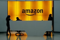 <p>In this Feb. 14, 2019 file photo, people stand in the lobby for Amazon offices in New York. Unifor says it has filed two applications to represent Vancouver-area Amazon workers to the B.C. Labour Relations Board. THE CANADIAN PRESS/AP-Mark Lennihan</p>