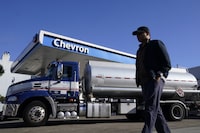 FILE - A man walks past a tanker at a Chevron gas station in San Francisco, Oct. 23, 2023. On Thursday, April 11, 2024, the Labor Department releases producer prices data for March. (AP Photo/Jeff Chiu, File)