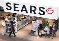 Shoppers enter and leave a Sears retail store in Toronto on Thursday, October 19, 2017. A court-appointed representative for Sears Canada retirees says Canada's bankruptcy laws should be changed to avoid financial hardship for members of other underfunded pension plans. THE CANADIAN PRESS/Nathan Denette