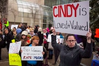 Protesters hold signs in support of Cindy Gladue outside Edmonton's city hall on April 2, 2015. The case of an Ontario trucker acquitted in the death of an Alberta woman referred to at trial as a "native" and a "prostitute" is to go before the Supreme Court this week in what could set a precedent in Canada's sexual assault laws. Bradley Barton says Cindy Gladue died after a night of consensual, rough sex in an Edmonton motel in June 2011. Her body was found in the bathtub after Barton called 911. She had an 11-centimetre cut in her vagina and had bled to death. THE CANADIAN PRESS/Topher Seguin