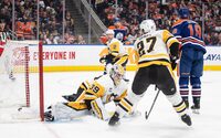 Pittsburg Penguins goalie Alex Nedeljkovic (39) is scored on by Edmonton Oilers' Zach Hyman (18) as Ryan Graves (27) defends during second period NHL action in Edmonton on Sunday March 3, 2024.THE CANADIAN PRESS/Jason Franson 