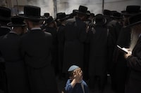 Ultra-Orthodox Jewish men and children burn leavened items in final preparation for the Passover holiday in the ultra-Orthodox Jewish town of Bnei Brak, near Tel Aviv, Israel, Monday, April 22, 2024. THE CANADIAN PRESS/AP, Oded Balilty