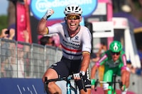 (FILES) Astana Qazaqstan Team's British rider Mark Cavendish celebrates as he crosses the finish line to win the twenty-first and last stage of the Giro d'Italia 2023 cycling race, 135 km in and around Rome on May 28, 2023. Veteran British sprinter Mark Cavendish will dump plans to retire so he can launch another attempt to break the record for Tour de France stage wins, his Astana team indicated on October 4, 2023. (Photo by Luca Bettini / AFP) (Photo by LUCA BETTINI/AFP via Getty Images)