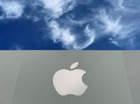 FILE PHOTO: The Apple logo is shown atop an Apple store at a shopping mall in La Jolla, California, U.S., December 17, 2019.  REUTERS/Mike Blake/File Photo