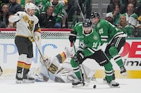 FILE - Vegas Golden Knights goaltender Logan Thompson, bottom, falls to the ice as Dallas Stars center Sam Steel (18) controls the puck during the second period of an NHL hockey game, Saturday, Dec. 9, 2023, in Dallas. All eight first-round matchups in the NHL playoffs are set after the last day of the regular season flipped two of the biggest series in the West. The defending Stanley Cup champion Vegas Golden Knights will open against the conference-champion Dallas Stars. (AP Photo/Julio Cortez, File)