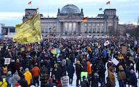 Participants gather during a demonstration against racism and far right politics in front of the Reichstag building in Berlin, Germany on January 21, 2024. Tens of thousands of people were expected to turn out again on January 21 to protest against the far-right AfD, after it emerged that party members discussed mass deportation plans at a meeting of extremists. (Photo by CHRISTIAN MANG / AFP) (Photo by CHRISTIAN MANG/AFP via Getty Images)