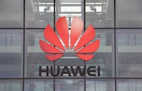 FILE PHOTO: Huawei logo is pictured on its headquarters building in Reading, Britain July 14, 2020. REUTERS/Matthew Childs/File Photo