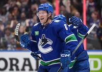 Vancouver Canucks' Brock Boeser celebrates his third goal against the Edmonton Oilers, during the second period of an NHL hockey game in Vancouver, on Wednesday, October 11, 2023. THE CANADIAN PRESS/Darryl Dyck