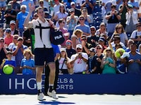 Aug 31, 2023; Flushing, NY, USA;  John Isner of the United States leaves the court after losing his second round match against Michael Mmoh of the United States on day four of the 2023 U.S. Open tennis tournament at the USTA Billie Jean King National Tennis Center. Mandatory Credit: Jerry Lai-USA TODAY Sports