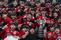 The Quebec Remparts celebrate with the Memorial Cup after Quebec defeated the Seattle Thunderbirds during Memorial Cup final hockey action, in Kamloops, B.C., on Sunday, June 4, 2023. THE CANADIAN PRESS/Darryl Dyck