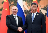 FILE PHOTO: Russian President Vladimir Putin shakes hands with Chinese President Xi Jinping during a meeting at the Belt and Road Forum in Beijing, China, October 18, 2023. Sputnik/Sergei Guneev/Pool via REUTERS/ File Photo