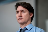 Prime Minister Justin Trudeau listens to a speaker during a news conference for a housing announcement in Vancouver, B.C., Wednesday, March 27, 2024. THE CANADIAN PRESS/Ethan Cairns 