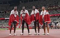 Memebrs of Canada's 4 X100-metre relay team celebrate their bronze medal win during the Tokyo Olympics in Tokyo, Japan on Friday, Aug.6, 2021. THE CANADIAN PRESS/Nathan Denette