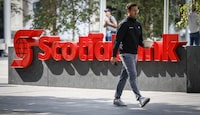 A pedestrian walks past a Scotiabank branch in downtown Calgary, Alta., Friday, Sept. 16, 2022.THE CANADIAN PRESS/Jeff McIntosh